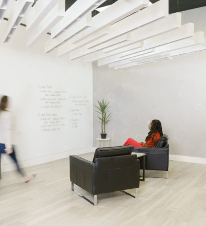 Fuse acoustic ceiling baffles in a huddle space