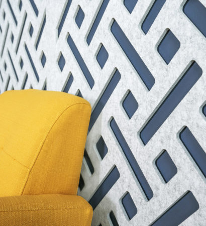 A closeup shot of Mur acoustic wall-mounted panel installed in a blue wall